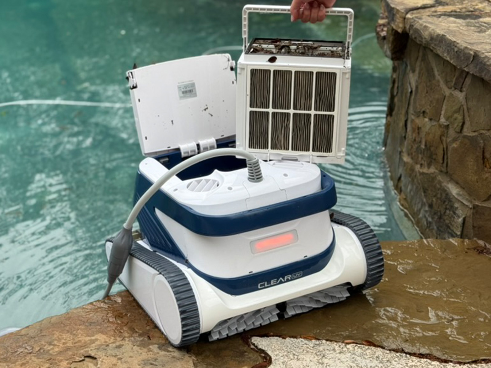 Holding the Clear UV's top-loading filter basket