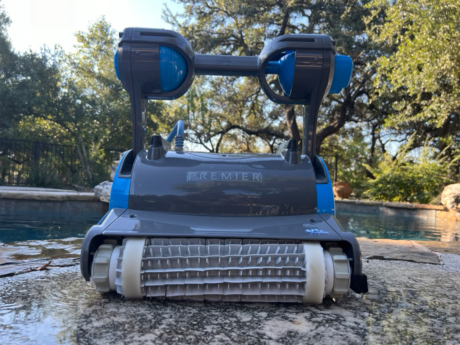 Straight-on front view of the Dolphin Premier showing the dual scrubbing brushes
