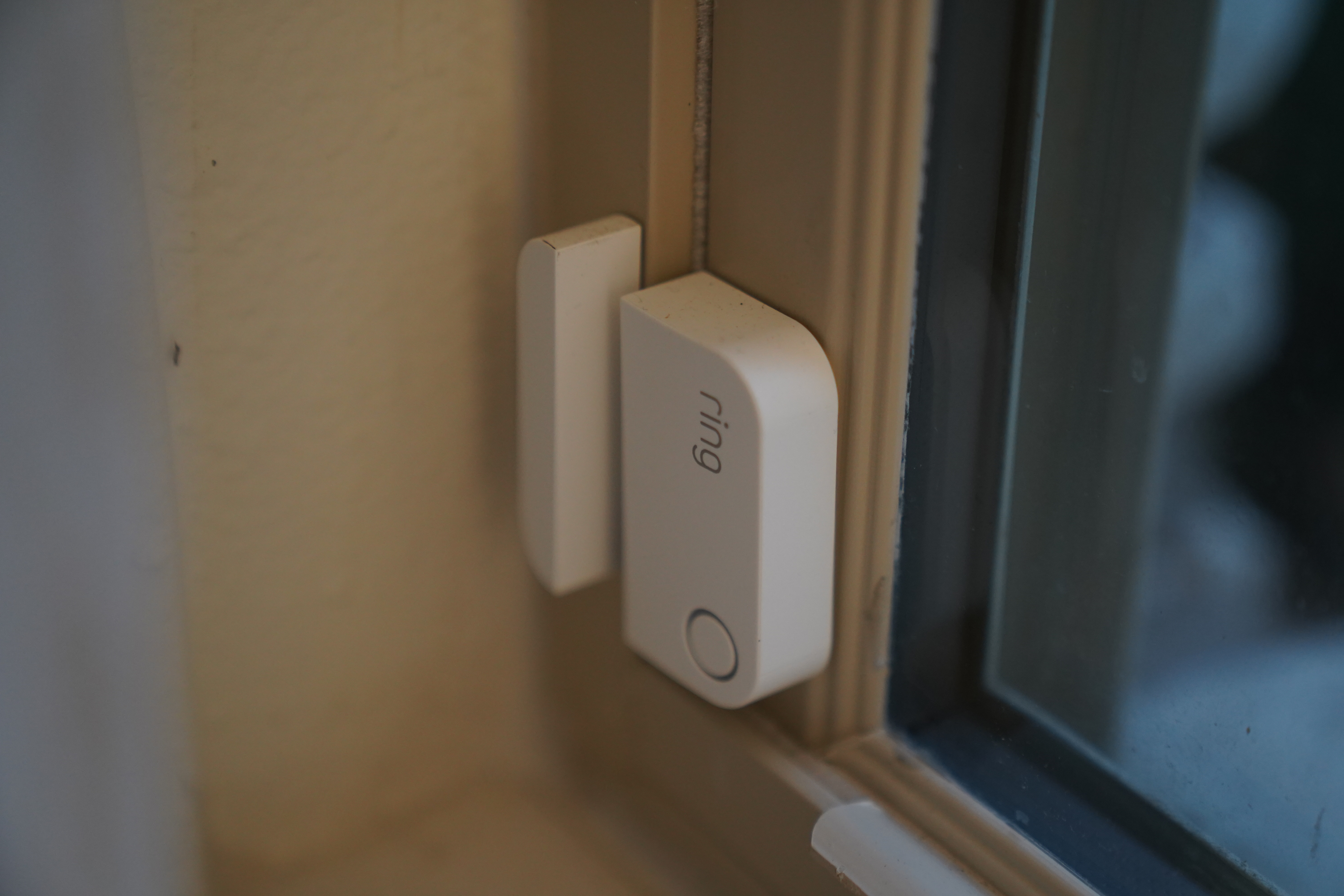 Close-up of a Ring Alarm contact sensor and its companion magnet