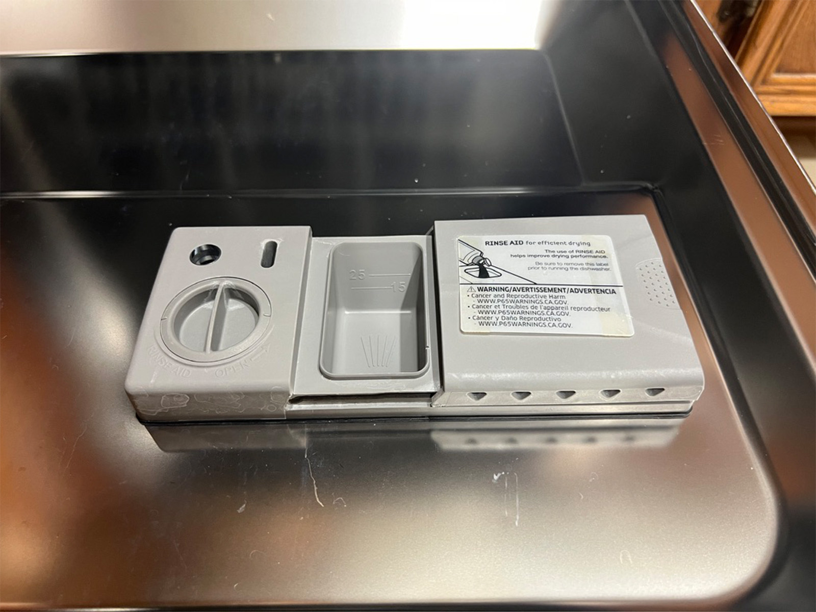 The Samsung StormWash detergent and rinse aid dispenser on the inner door