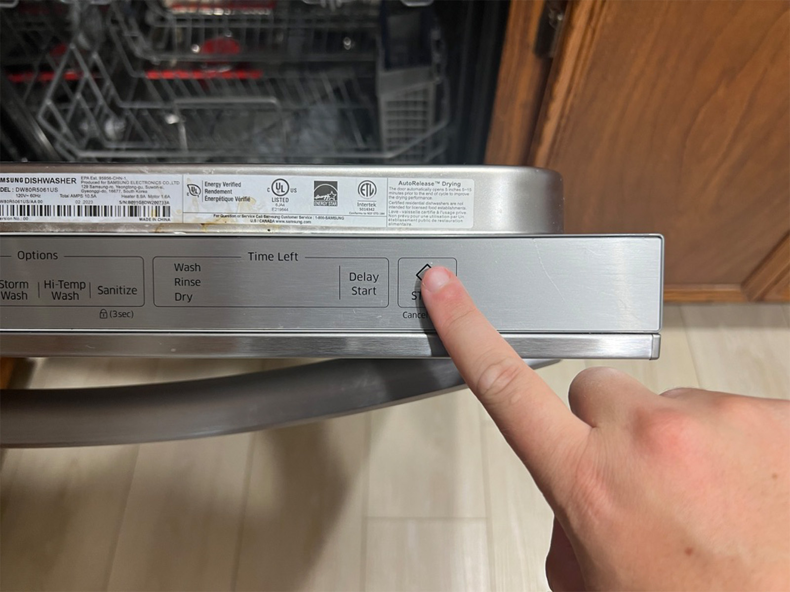 Starting a cycle on the Samsung StormWash with a press of the Start button on the top-edge control strip