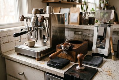 A home espresso testing setup with machine, scale, tamper and portafilter
