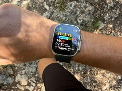 An Apple Watch Ultra 2 showing a steady Zone 2 heart rate mid-run