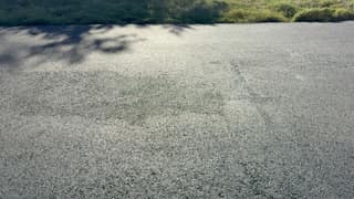 The same stretch under the trees after sealing