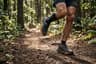 A runner moving at an easy pace on a soft forest trail