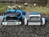 An older blue-and-black Nautilus CC Plus on the left beside the Dolphin Cayman on the right