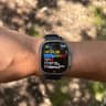 Apple Watch Ultra 2 on a wrist showing a running workout in heart-rate Zone 1