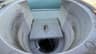 The grime ring and debris inside a built-in skimmer before cleaning