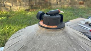 Manual air relief valve on top of a Hayward cartridge filter tank
