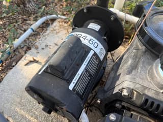 Polaris PB4-60 pressure cleaner booster pump on a pool equipment pad