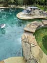 Clear pool water after treatment with the patio and surface skimmer in view