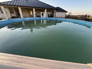 The murky above-ground pool before the NanoFilter cleanup started