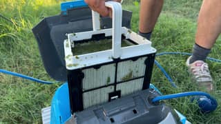 A Cayman MaxBin lifted out with the filter panels visible