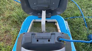 The Dolphin Cayman with its top cover open and the MaxBin full of algae