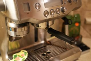 The portafilter locked into the group head with no hands