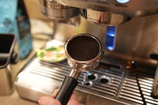 A spent puck in the portafilter after the shot