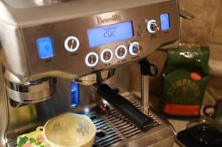 Three-quarter view of the Breville Oracle with the portafilter locked in
