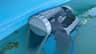 The Dolphin Cayman reaching the top of an above-ground pool wall