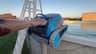 The Dolphin Escape resting on the pool rail after a cleaning cycle