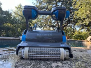 The powered scrubbing brushes across the front of the Dolphin Premier