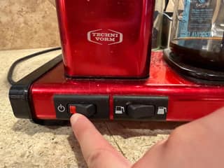 The red indicator glowing as I press the Moccamaster KBGV power switch
