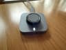 The compact Oura Ring 4 charging puck on my desk
