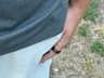 The compact Oura Ring 4 beside a pocket