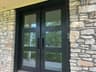 The wide view of the double front doors and stone facade the Ring Video Doorbell Pro watches over