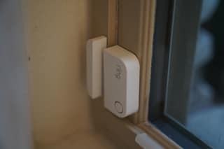 Close-up of a Ring Alarm contact sensor and its companion magnet