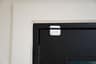 A Ring Alarm contact sensor on the top of a front door